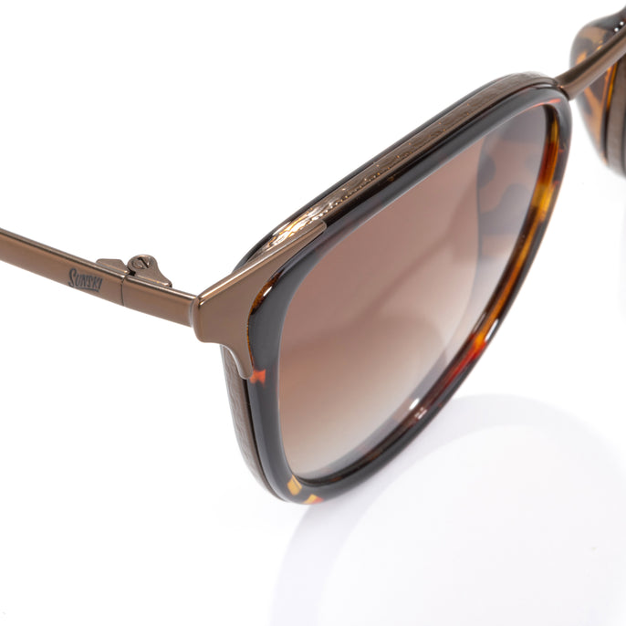 Brown sunglasses with tortoiseshell frame on a white background
