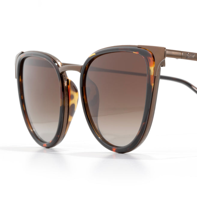 Sunglasses with tortoiseshell frame and brown gradient lenses on a white background