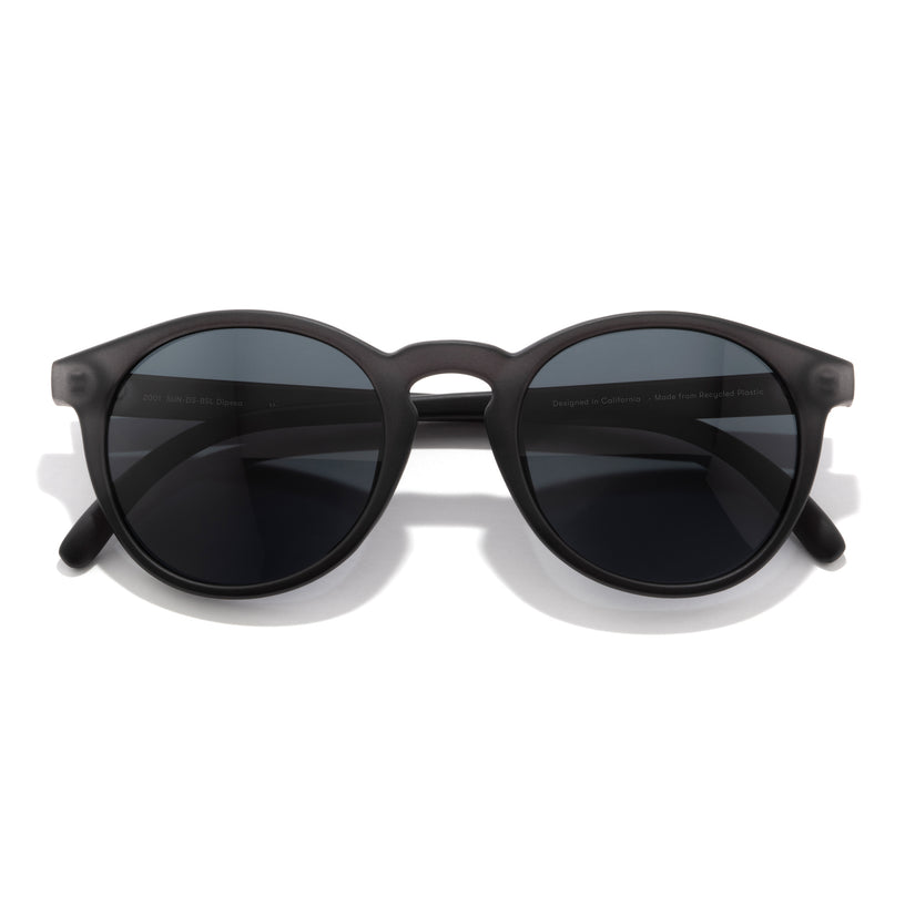 Black sunglasses with dark lenses on a white background
