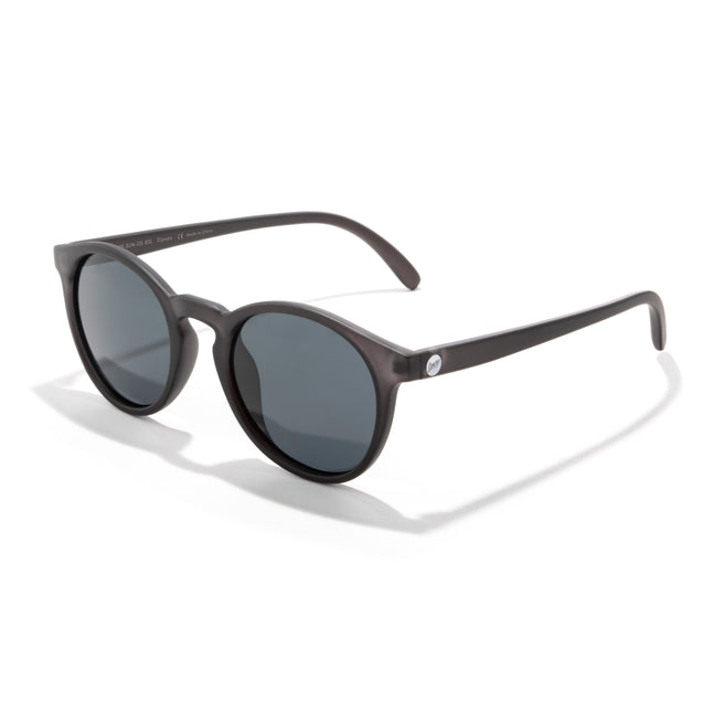 Sunglasses with dark lenses and brown frame on a white background