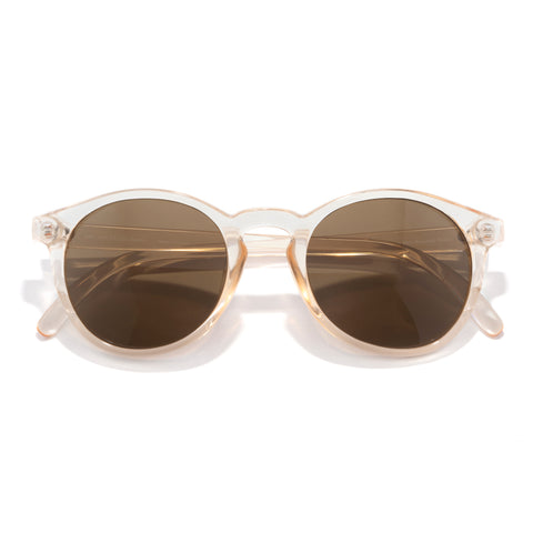 Sunglasses with gold frame and brown lenses on a white background