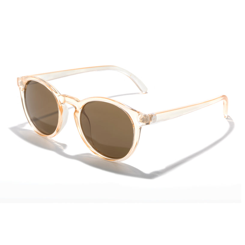 Sunglasses with gold frame and brown lenses on a white background