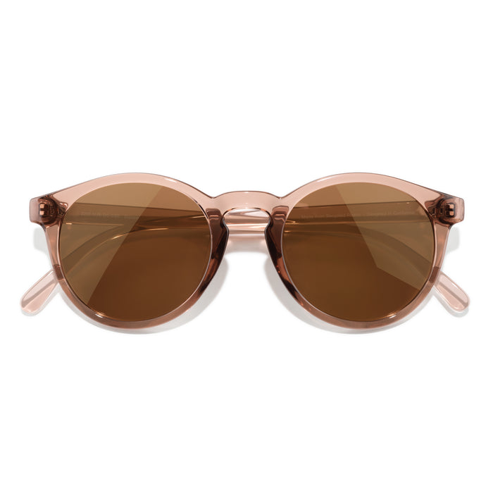 Round sunglasses with rose gold frame and brown lenses on a white background