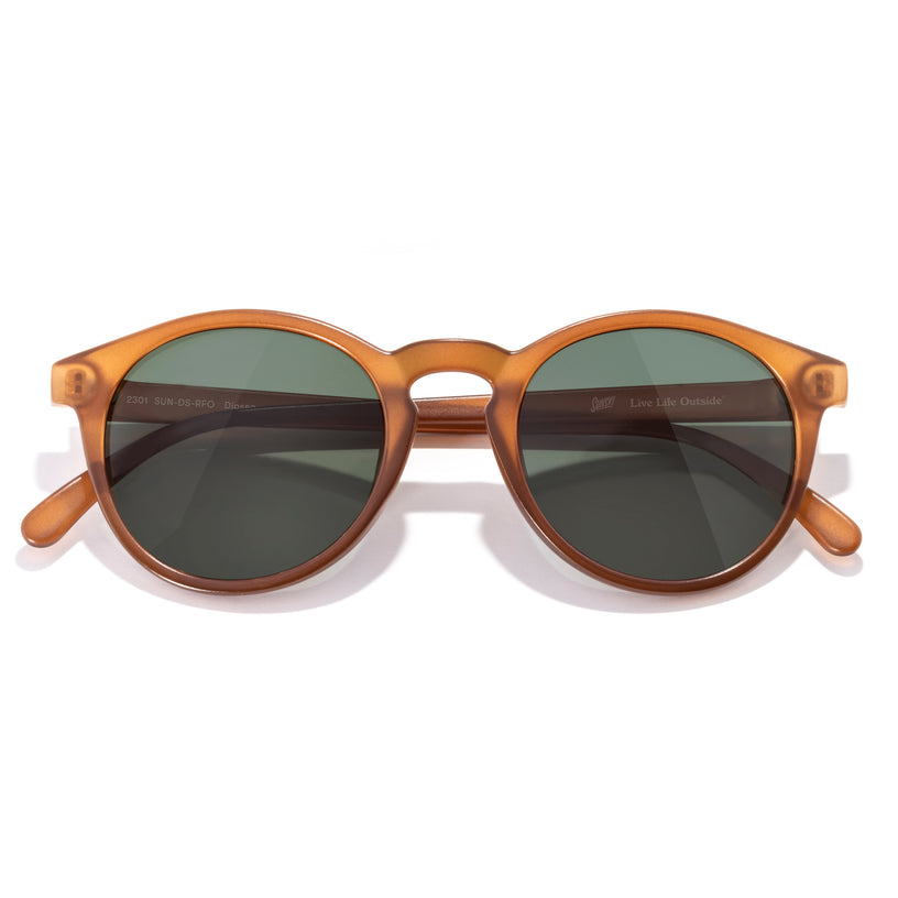 Brown sunglasses with dark lenses on a white background