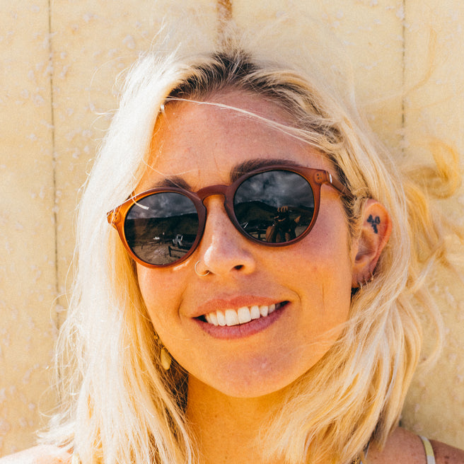 Woman wearing sunglasses with a blurred background