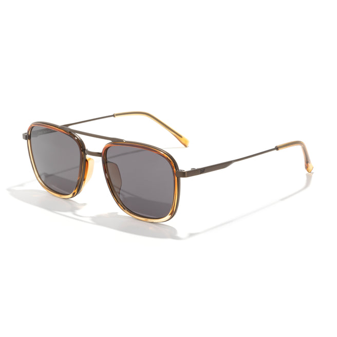Sunglasses with gold frame and dark lenses on a white background