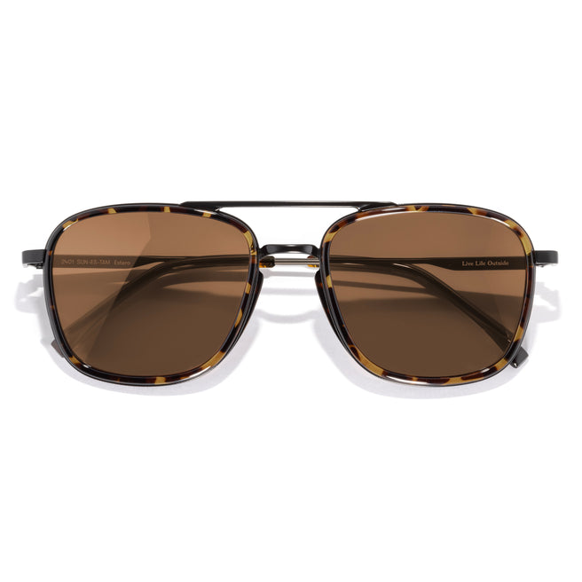 Sunglasses with brown lenses and tortoiseshell frame on a white background