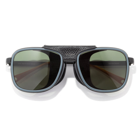 Sunglasses with dark lenses and textured black frame on a white background