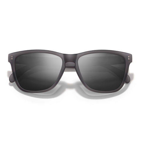 Sunglasses with dark lenses on a white background