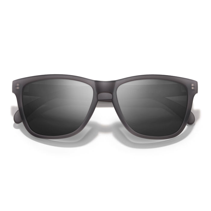 Sunglasses with dark lenses on a white background