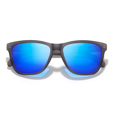 Sunglasses with blue reflective lenses and black frame on a white background