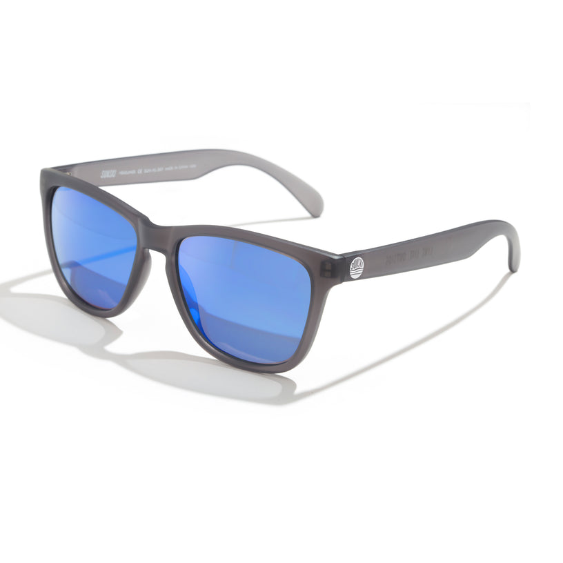 Sunglasses with blue lenses and gray frame on a white background