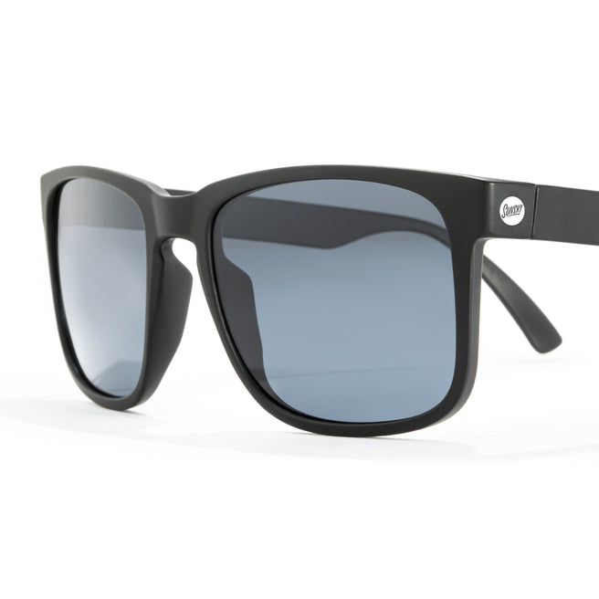 Black sunglasses with gray lenses on a white background
