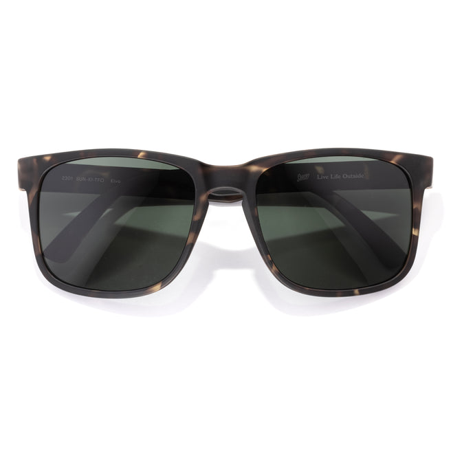 Sunglasses with tortoiseshell frame and dark lenses on a white background