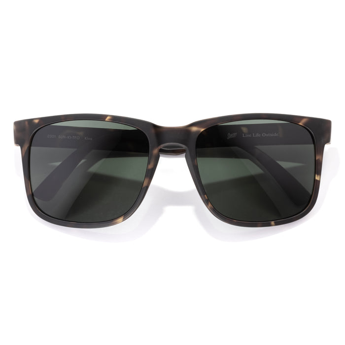 Sunglasses with tortoiseshell frame and dark lenses on a white background