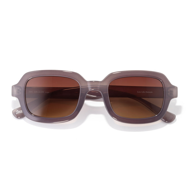 Sunglasses with brown lenses and gray frames on a white background