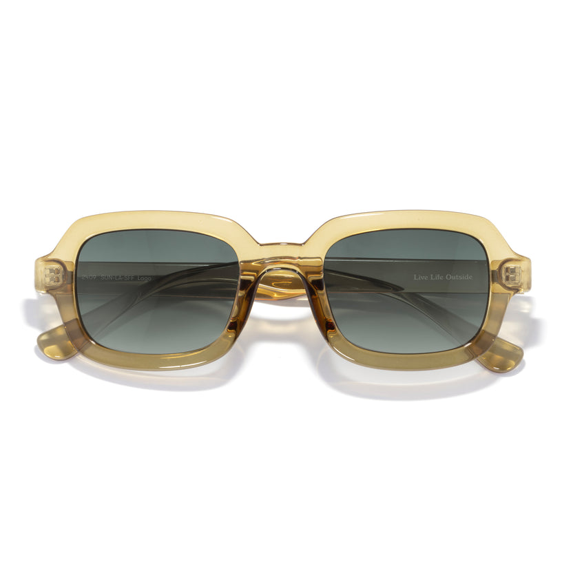 Gold-framed sunglasses with dark lenses on a white background