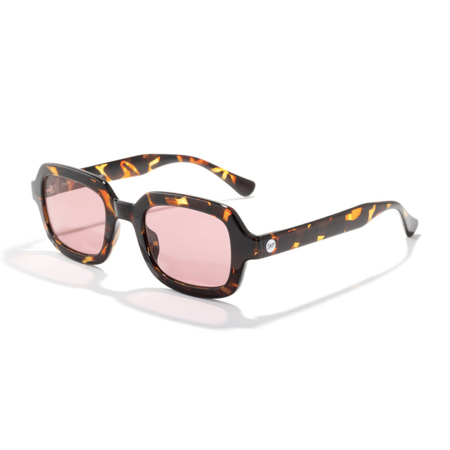 Sunglasses with tortoiseshell frame and pink lenses on a white background
