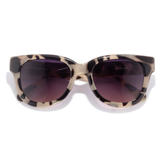 Sunglasses with tortoiseshell frame and dark lenses on a white background