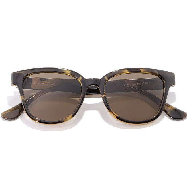 Sunglasses with tortoiseshell frame and brown lenses on a white background