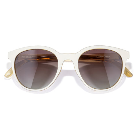 White sunglasses with gold accents on a white background