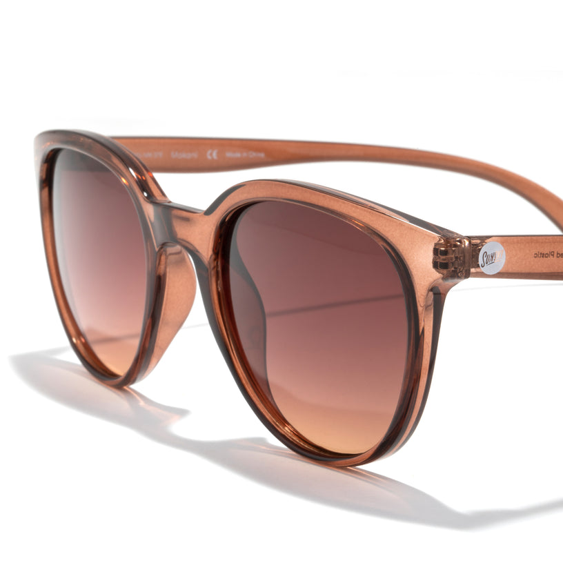 Brown sunglasses with gradient lenses on a white background