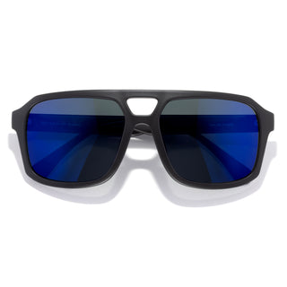 Sunglasses with blue lenses and black frame on a white background