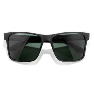 Black sunglasses with dark lenses on a white background