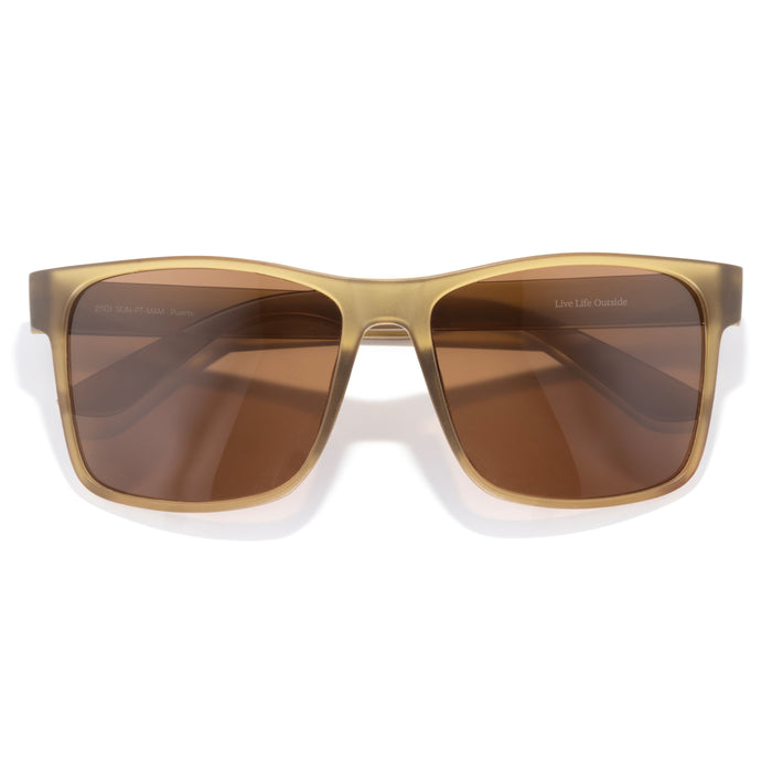 Sunglasses with brown lenses and gold frame on a white background
