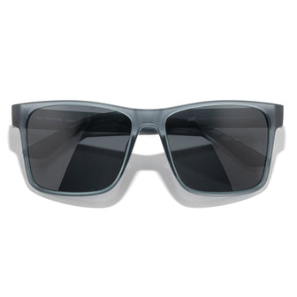 Sunglasses with gray frame and dark lenses on a white background