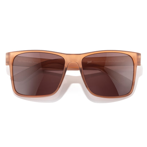 Brown sunglasses with a reflective surface on a white background