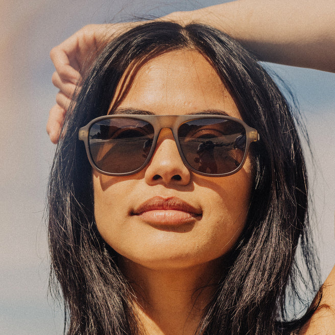 Woman wearing sunglasses with a blurred background