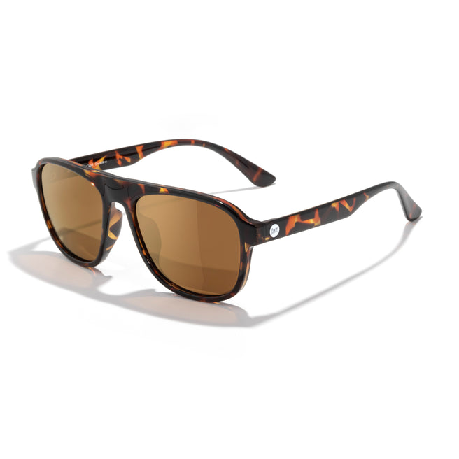 Sunglasses with tortoiseshell frame and brown lenses on a white background