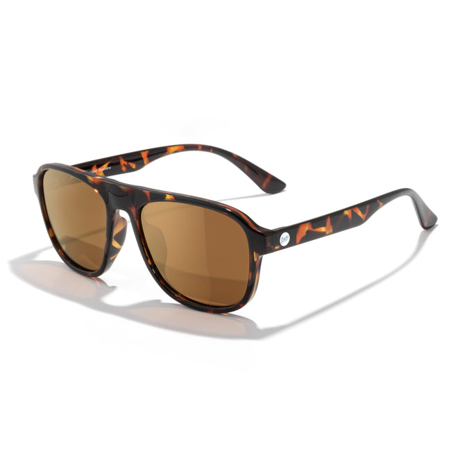 Sunglasses with tortoiseshell frame and brown lenses on a white background