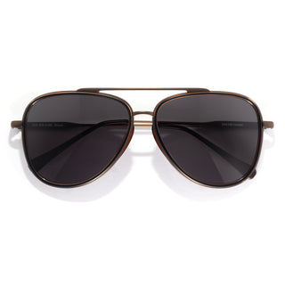 Aviator sunglasses with dark lenses on a white background