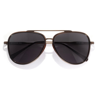 Aviator sunglasses with dark lenses on a white background