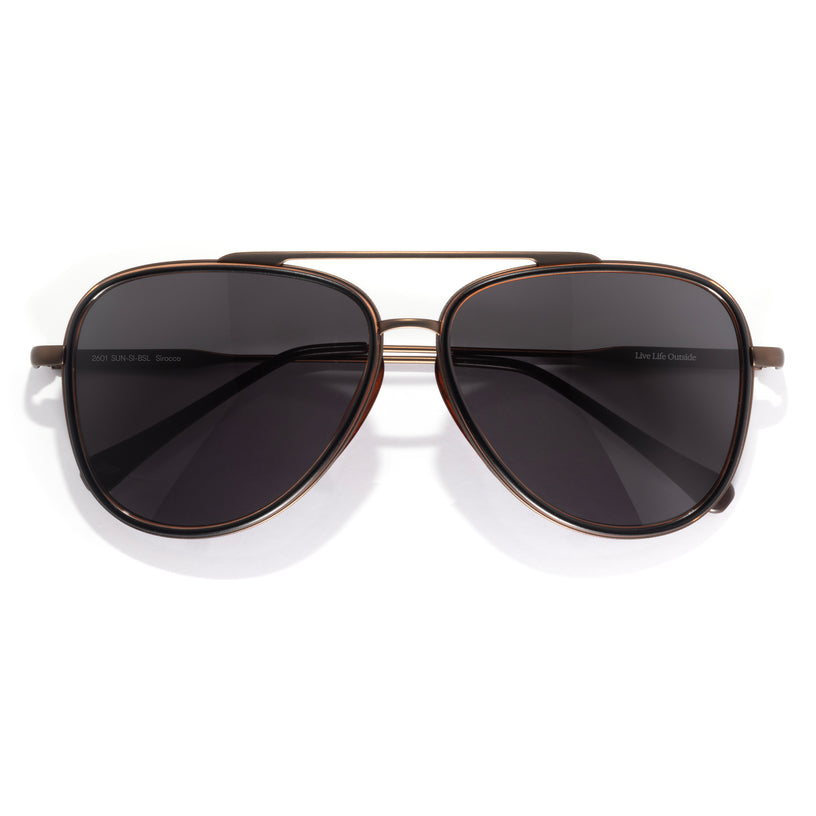 Aviator sunglasses with dark lenses on a white background