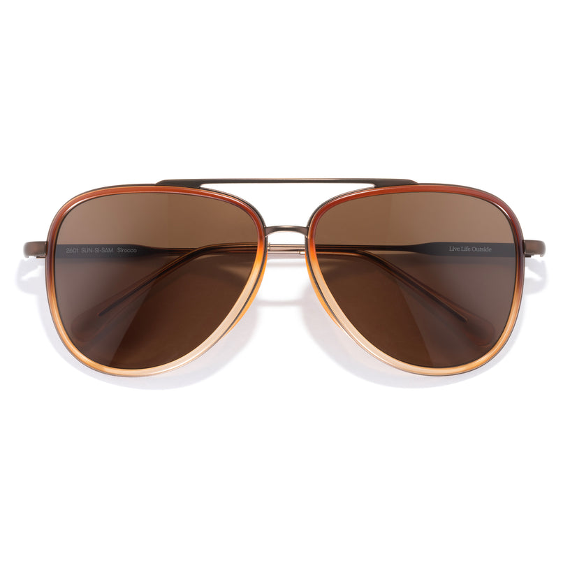Aviator sunglasses with brown lenses on a white background