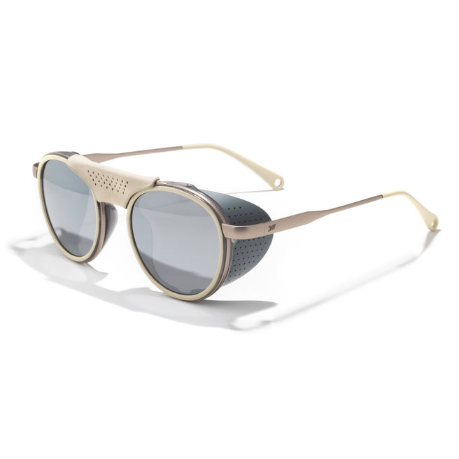 Sunglasses with gold frame and dark lenses on a white background