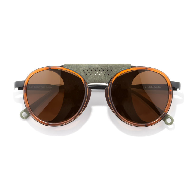 Sunglasses with brown lenses and a metallic frame on a white background