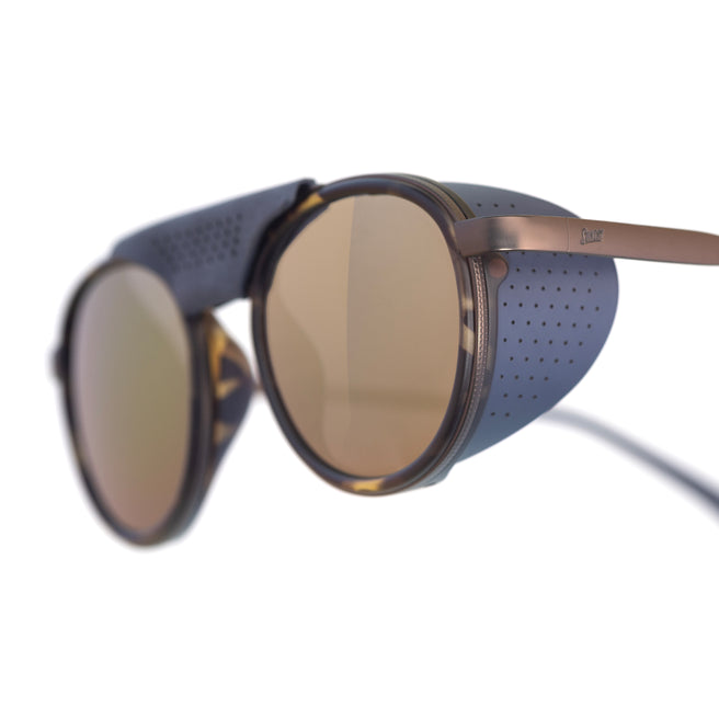 Sunglasses with blue frame and brown lenses on a white background