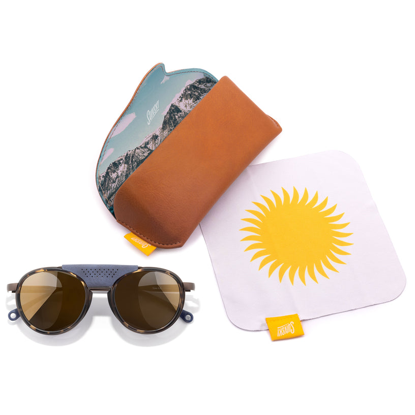 Sunglasses with a carrying hard case, and a microfiber cloth with a sun design.