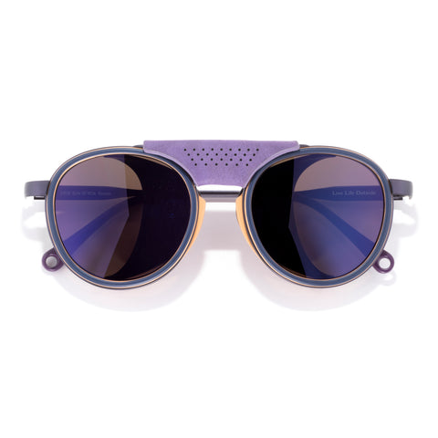 Sunglasses with purple frame and lenses on a white background