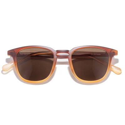 Tango - Solstice Amber - Sunglasses with brown gradient lenses and a tortoiseshell frame on a white background