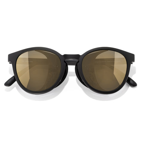 Black sunglasses with brown lenses on a white background