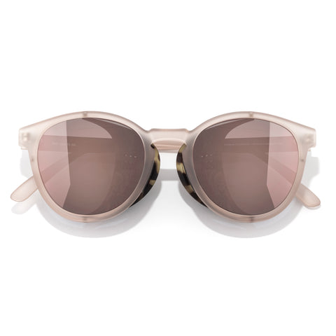 Sunglasses with a beige frame and brown lenses on a white background