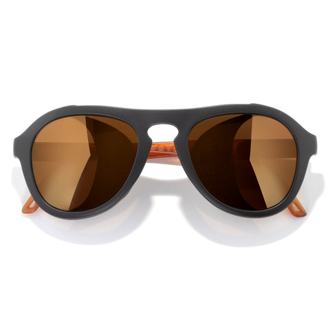Sunglasses with black frame and brown lenses on a white background