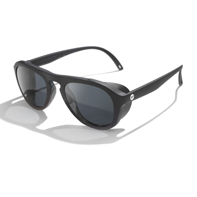 Black sunglasses with dark lenses on a white background