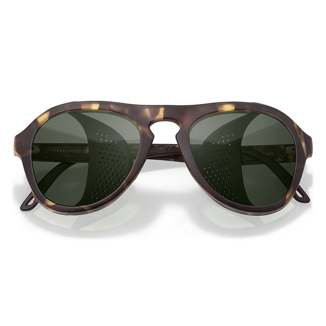 Sunglasses with tortoiseshell frame and dark lenses on a white background