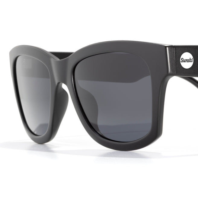 Black sunglasses with a white background